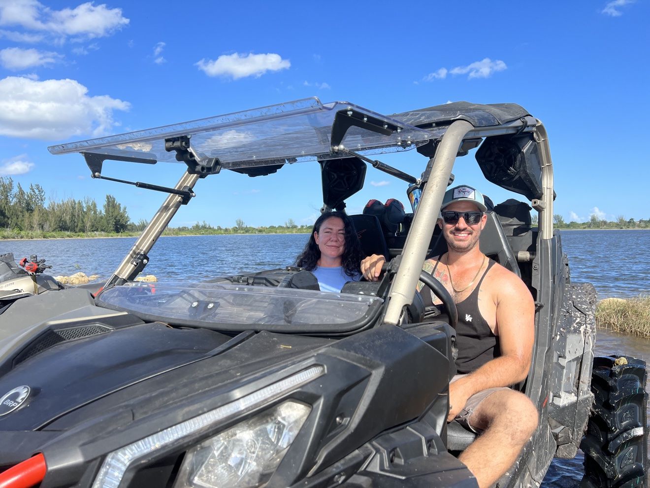 Couple riding in a SXS